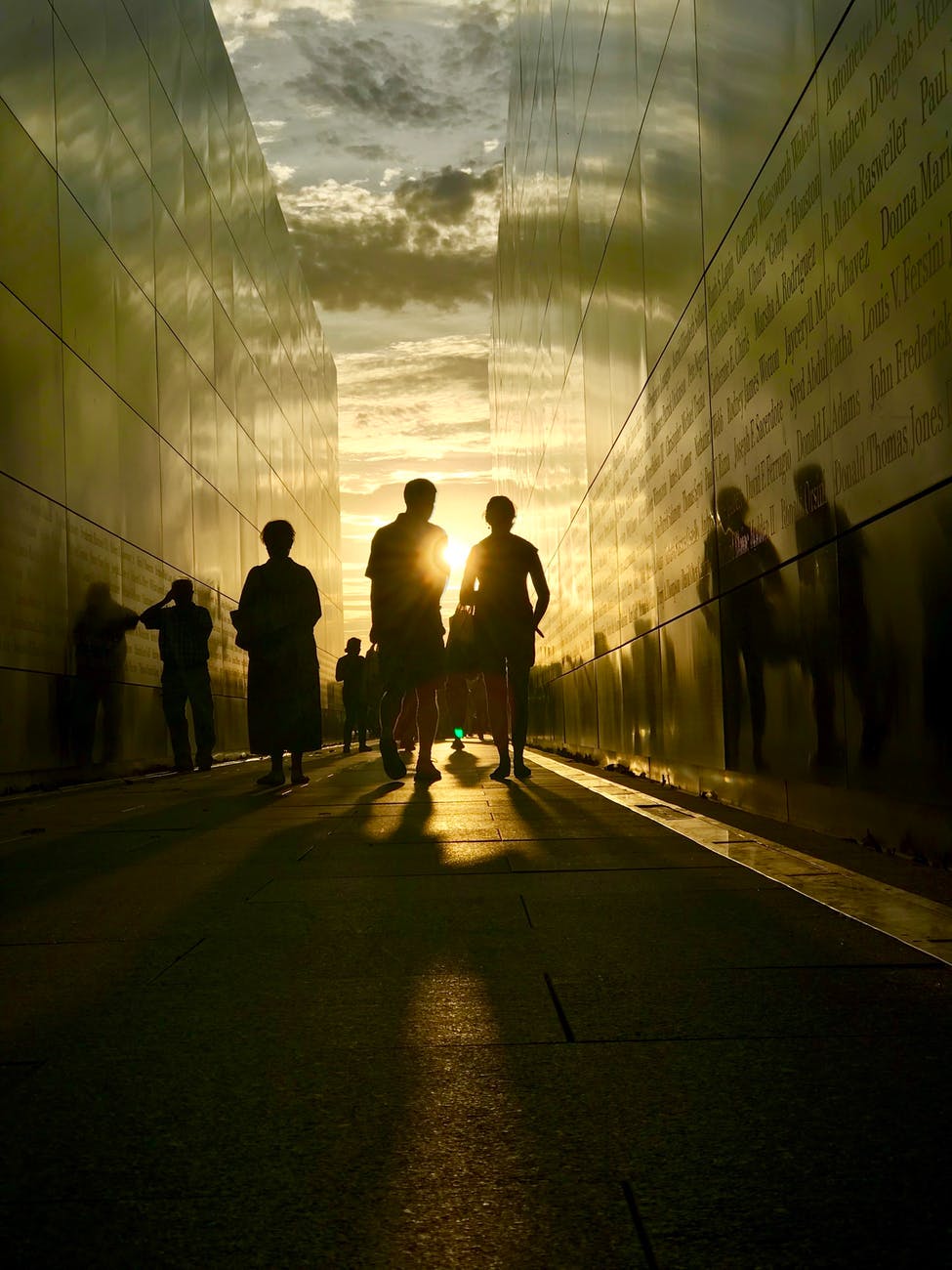 silhouette of people walking