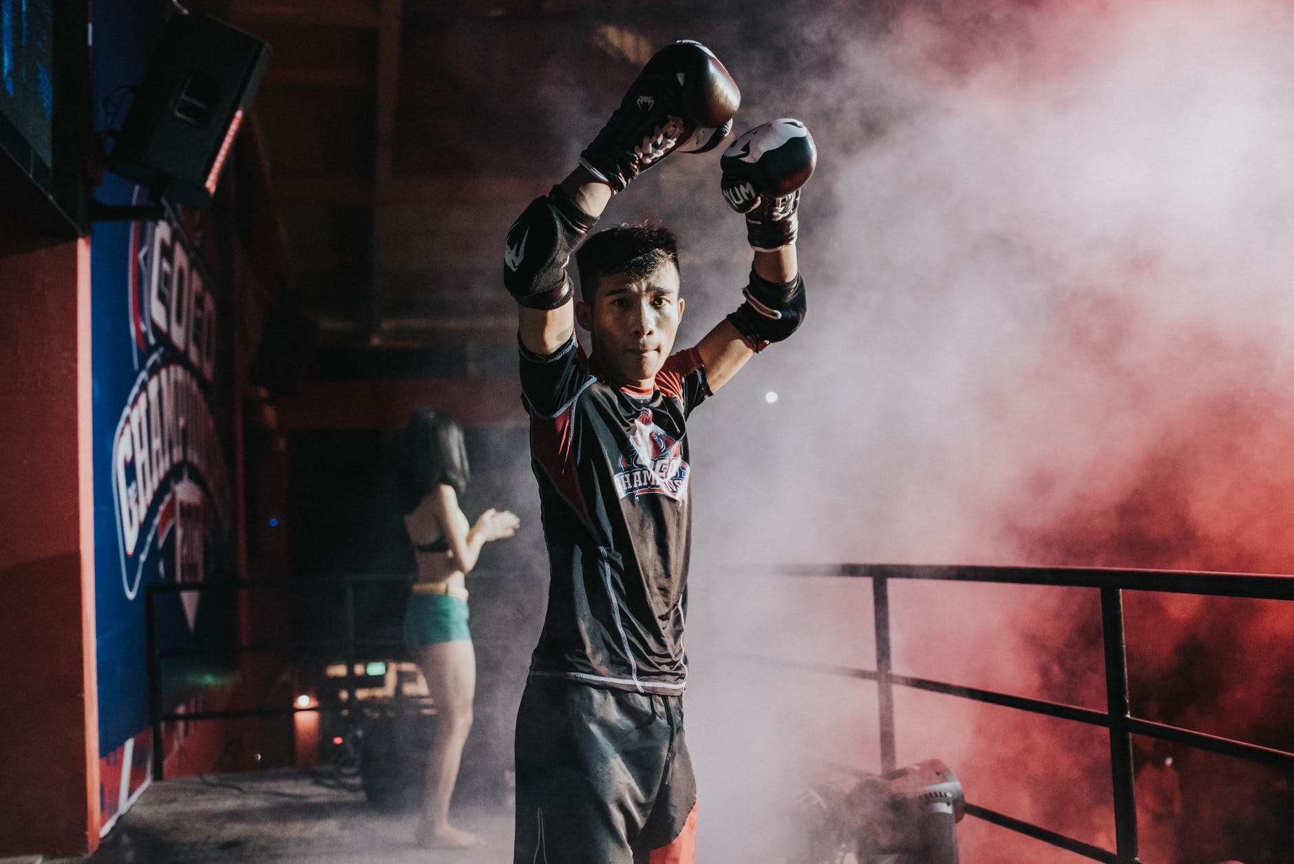 man raising his hands