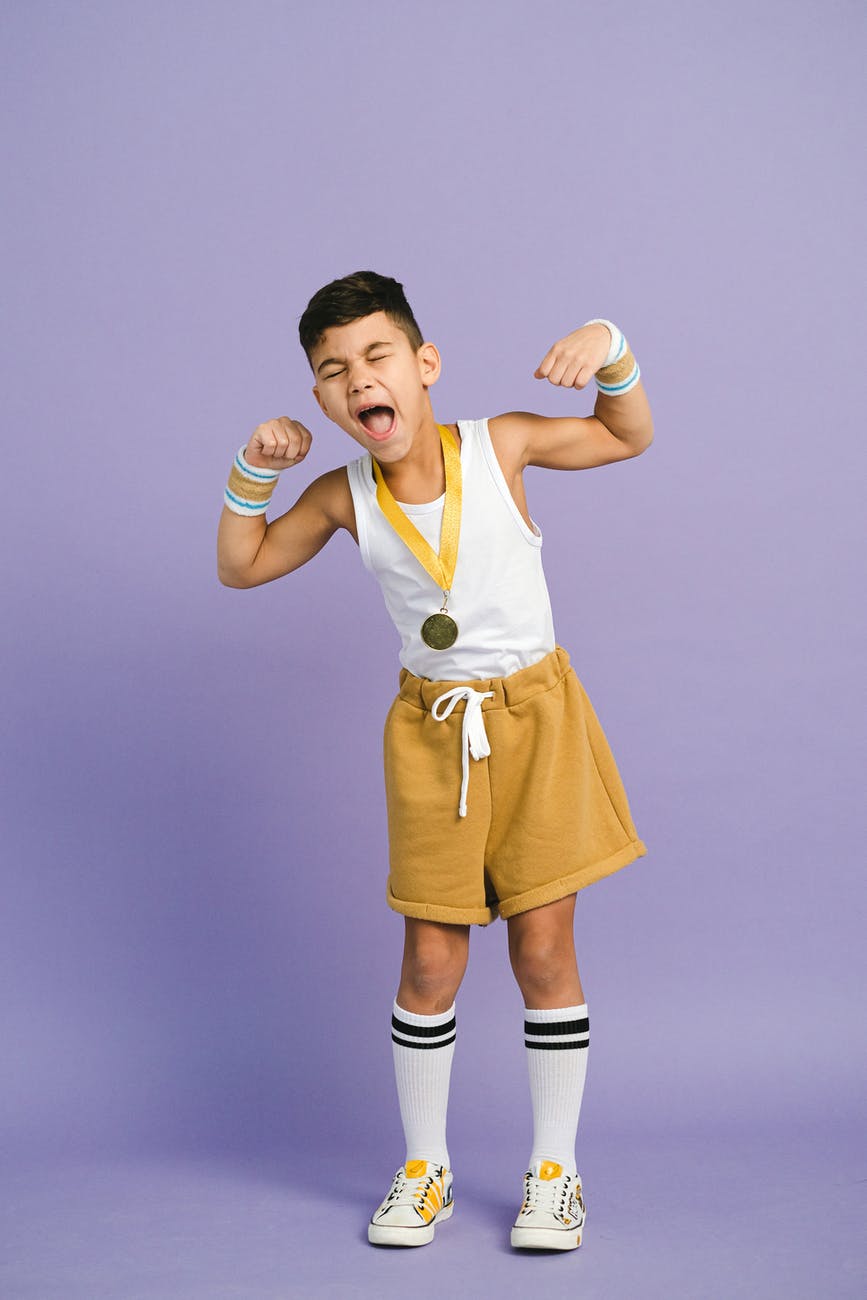 a boy wearing a medal